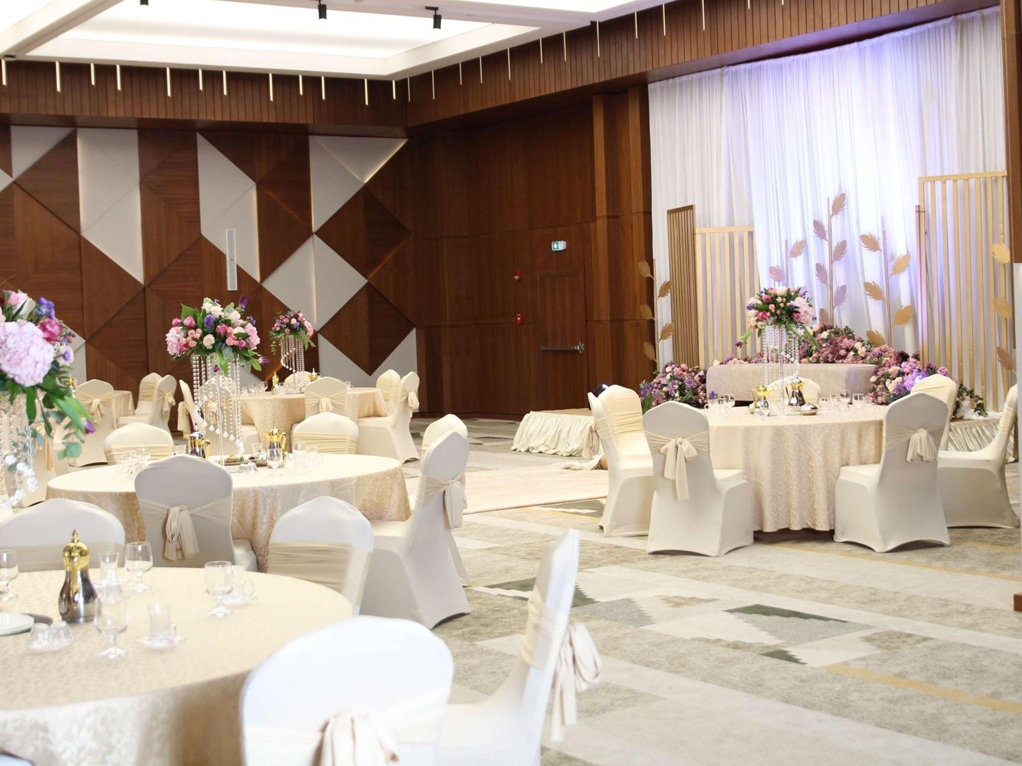 Swissotel Living Jeddah Exterior photo A wedding reception at the Grand Ballroom